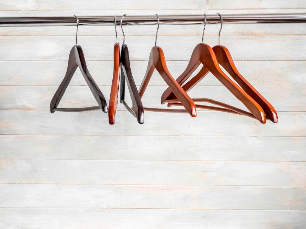 Brown wooden hangers on the rack