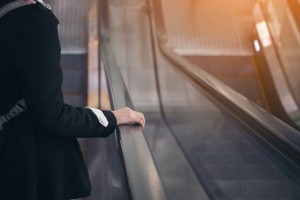 Point of view of a women riding an escalator to the second floor