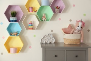 Bright colorful shelves on light wall in room. Interior design