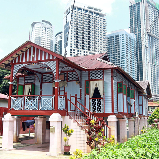 Traditional houses depicting the Malay architecture identity stand out against the backdrop of the KL city centre, giving a sharp contrast between the old and the new.