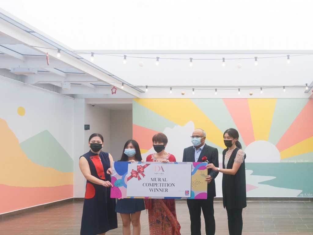 (From left) Nippon Paint Malaysia manager Celene Tan, To, Tan, Mohd Sayuthi and TA Global interior design manager Chong Sinn Dee pose for a group photo in front of the winning mural.