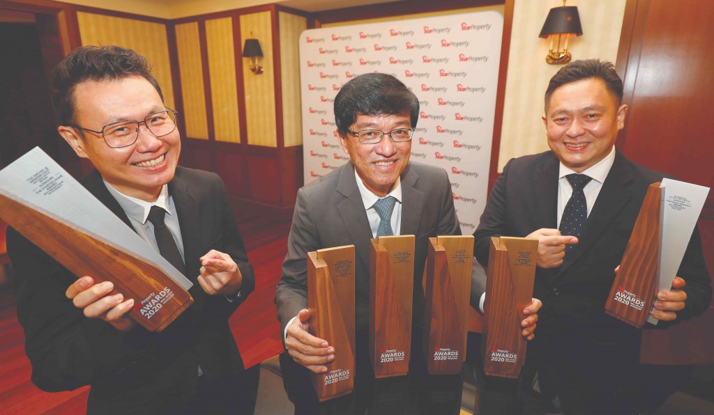 It’s all smiles for Mah Sing CEO Datuk Ho Hon Sang (centre), chief operating officer Yeoh Chee Beng (right) and sales and marketing general manager Chris Chen Weng Hong as they show the number of trophies the group has won.