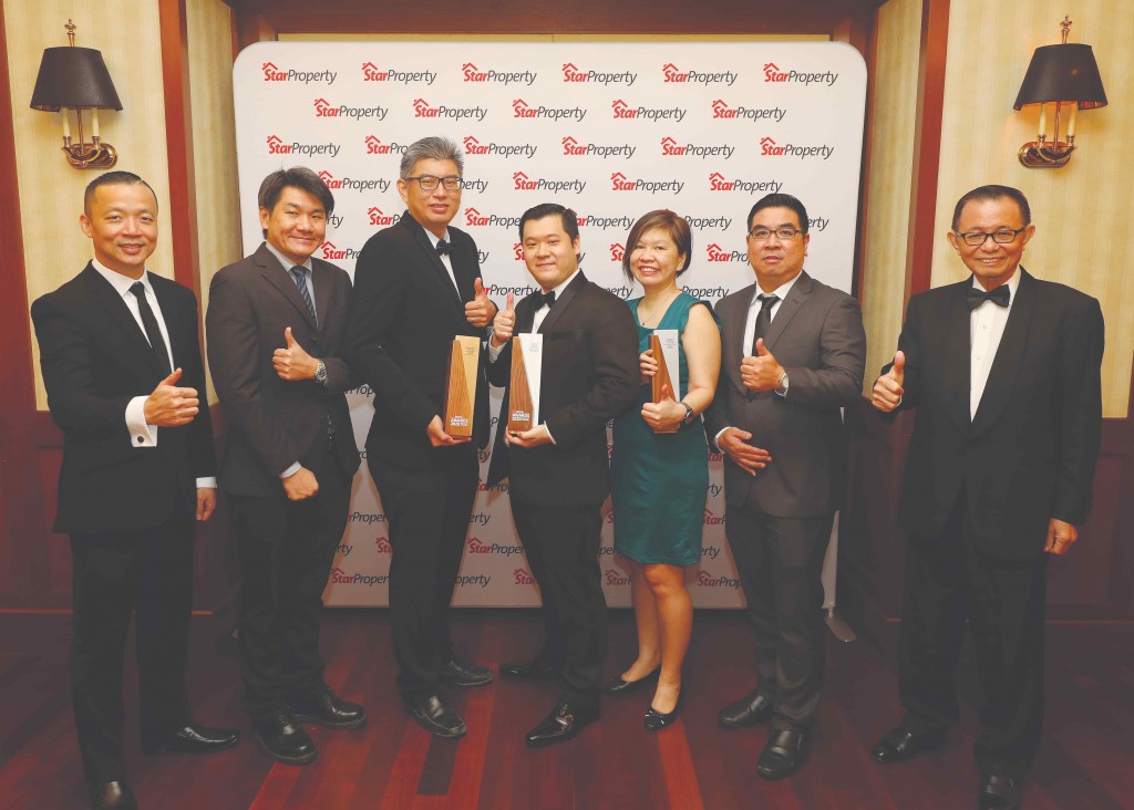 Giving the thumbs up after YNH Property bags three trophies are (from left) Yap, YNH property contract manager How Kean Lok, assistant development manager Yu Chong Cheng, corporate strategy general manager James Ngio, marketing manager Alyz Yeap, development manager Teo Ling Piau and Fu.