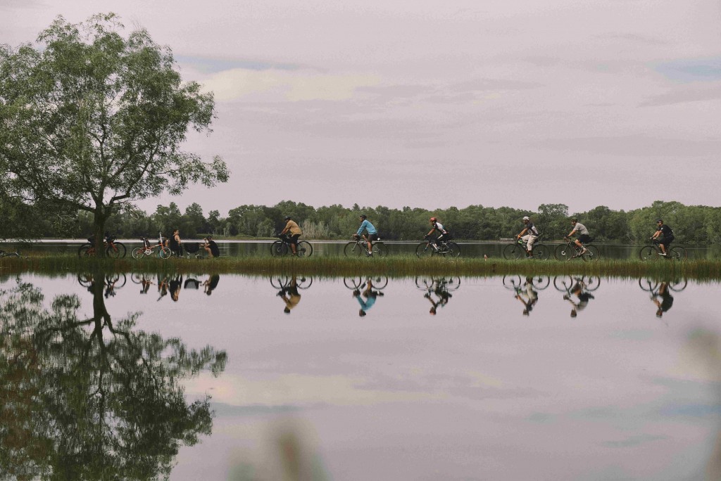 Residents cycling along the pathway in the nature-inspired Gamuda Cove.