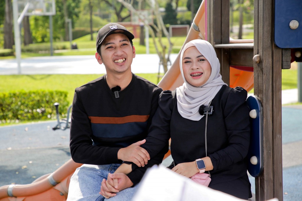 After receiving their keys, Jazlan (left) and Afiqah said Lakefield Residence is a good place to raise children.