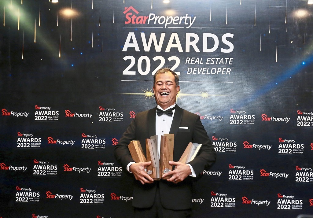 A happy man indeed: UDA Holdings property development chief operating officer Noor Azmi Salleh having a cheerful moment with all his trophies.