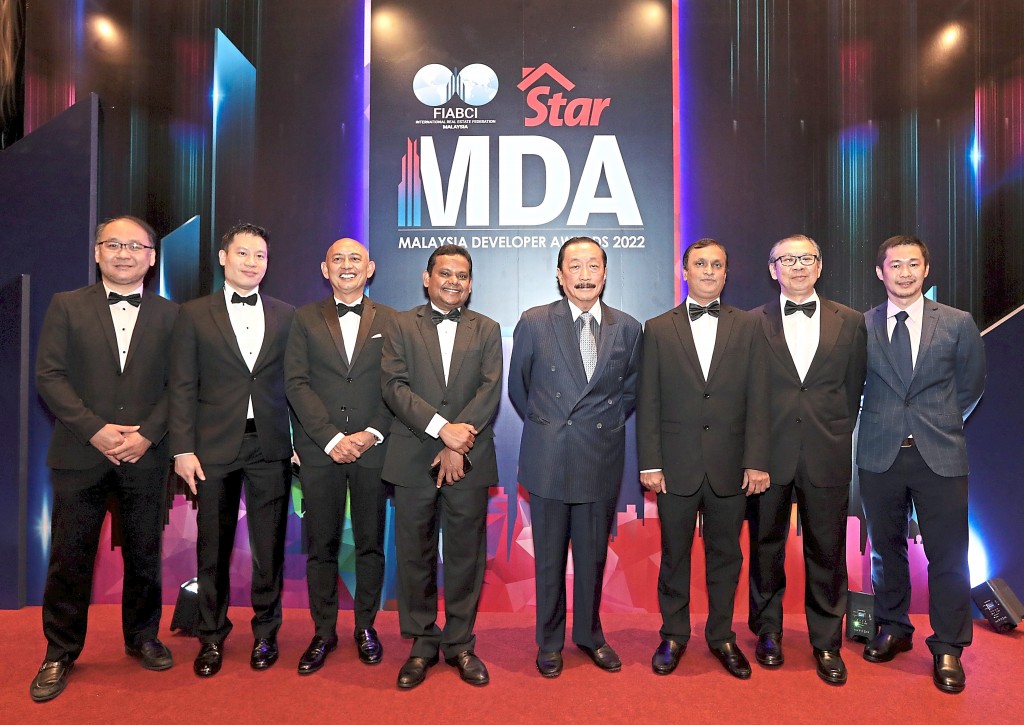 Berjaya Corporation Bhd chairman Tan Sri Vincent Tan Chee Yioun (5th from left) and Joint group  chief executive officer Syed Ali Shahul Hameed (4th from left) with their team.