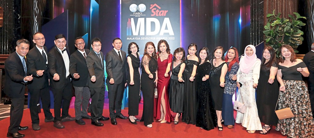 AYER Holdings Bhd group chief operating officer Jeannie Khoo (in red) with her team.