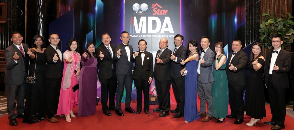 Symphony Life Bhd executive chairman Tan Sri Tan Khoon Hai (eighth from left) with his team.