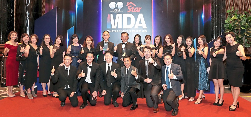 Sunway Property central region senior executive director Chong Sau Min (standing ninth from left) with his  team.