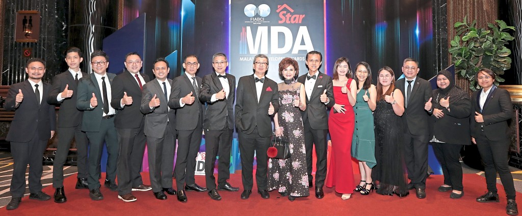 LBS Bina Group Bhd executive chairman Tan Sri Lim Hock San and his wife Puan Sri Karen (centre couple)  with his team.