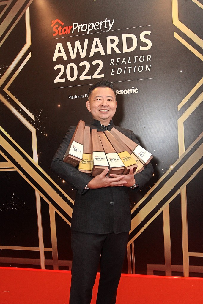Tech Realtors Properties founder and managing director Alex Lee with the trophies and all smiles with the team’s winnings.