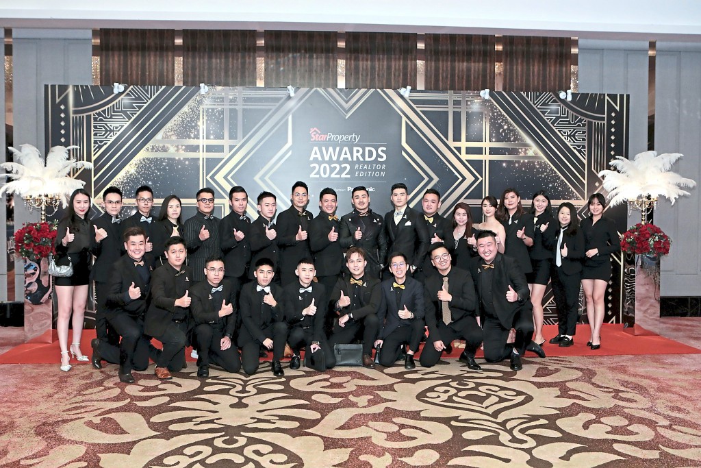 The Nexsgen Realty team gives the thumbs up to the event.