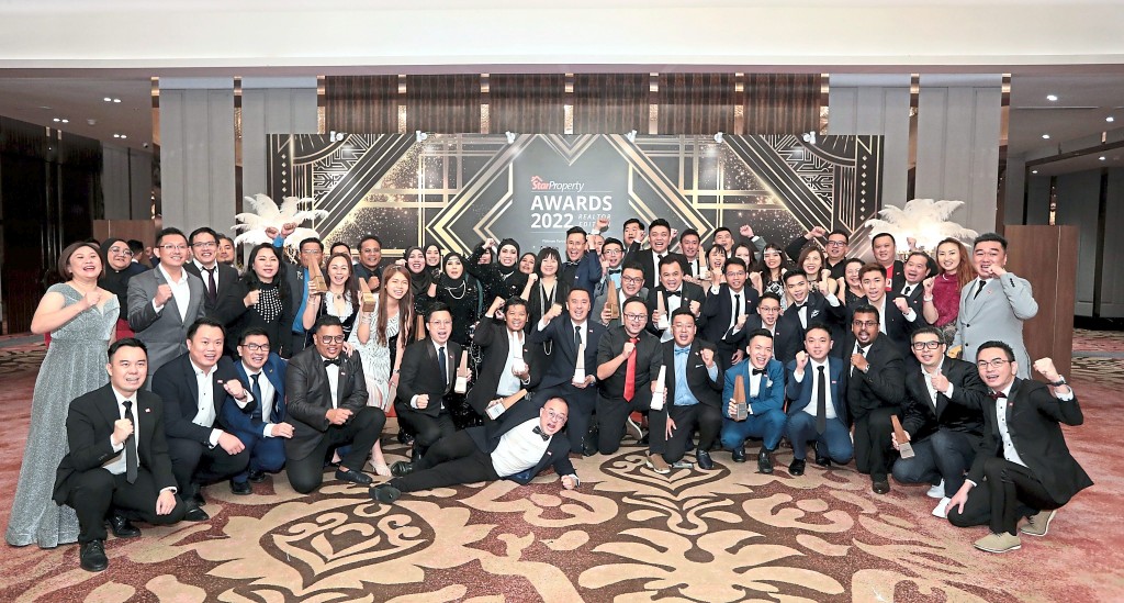 IQI Realty members celebrating their big win.