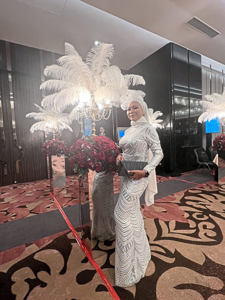 Noor Hidayah from Firdaus & Associates Real Estate Agency strikes a vogue pose.