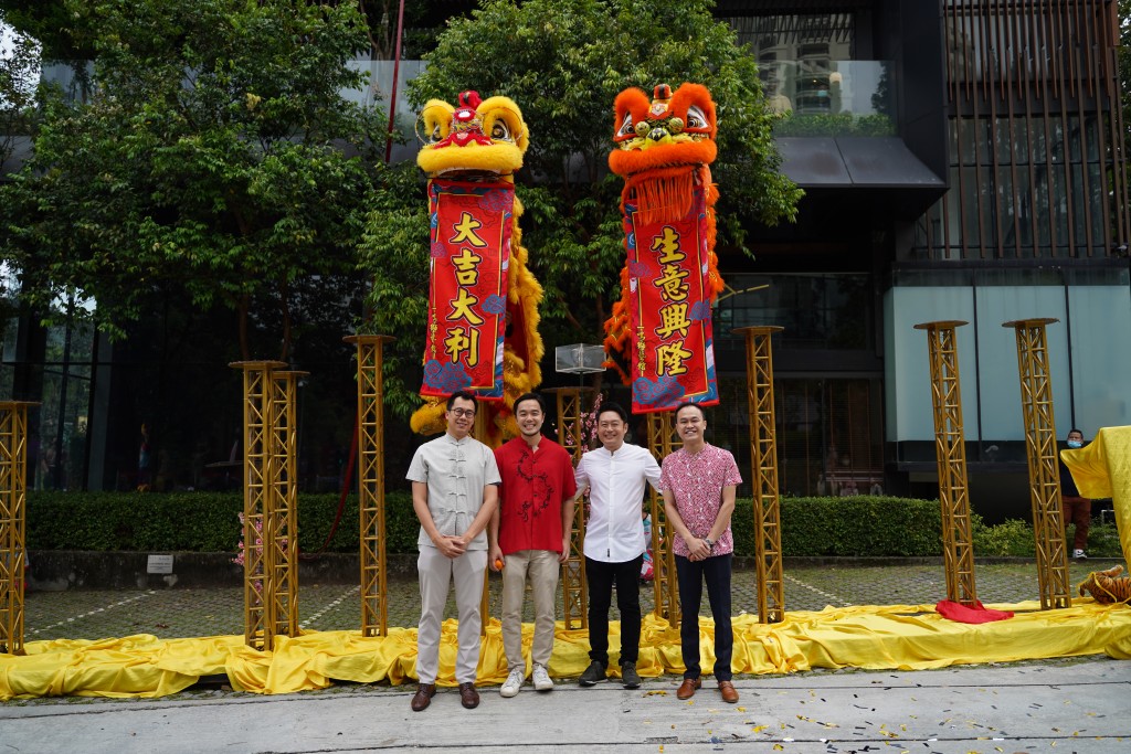 Chan, Goh, Tan and Ng taking a group photo after the lion dance performance.
