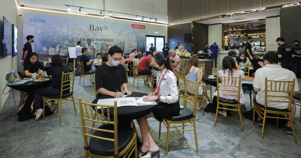 Buyers in the process of purchasing their units at the launch of Bay Street commercial shops.