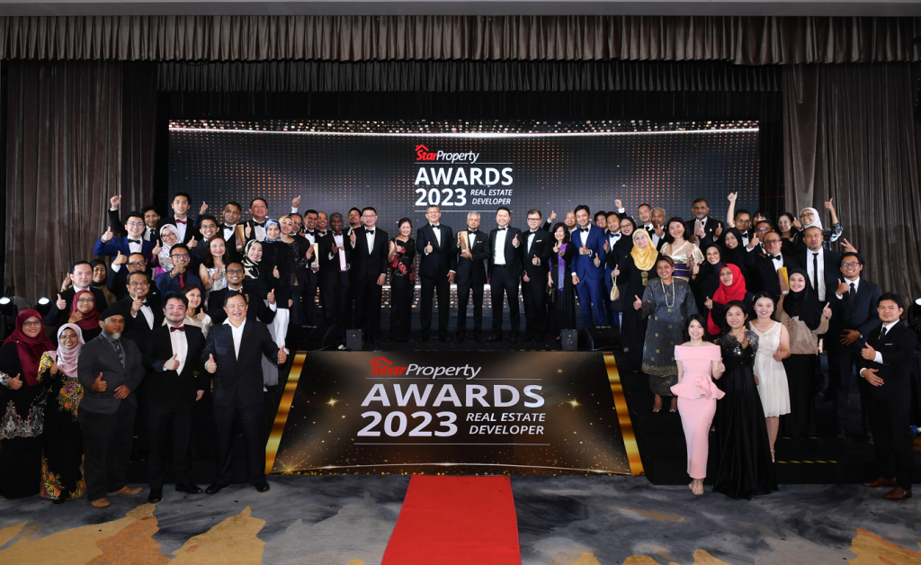 The Sime Darby Property team celebrates the big win with Azmir.