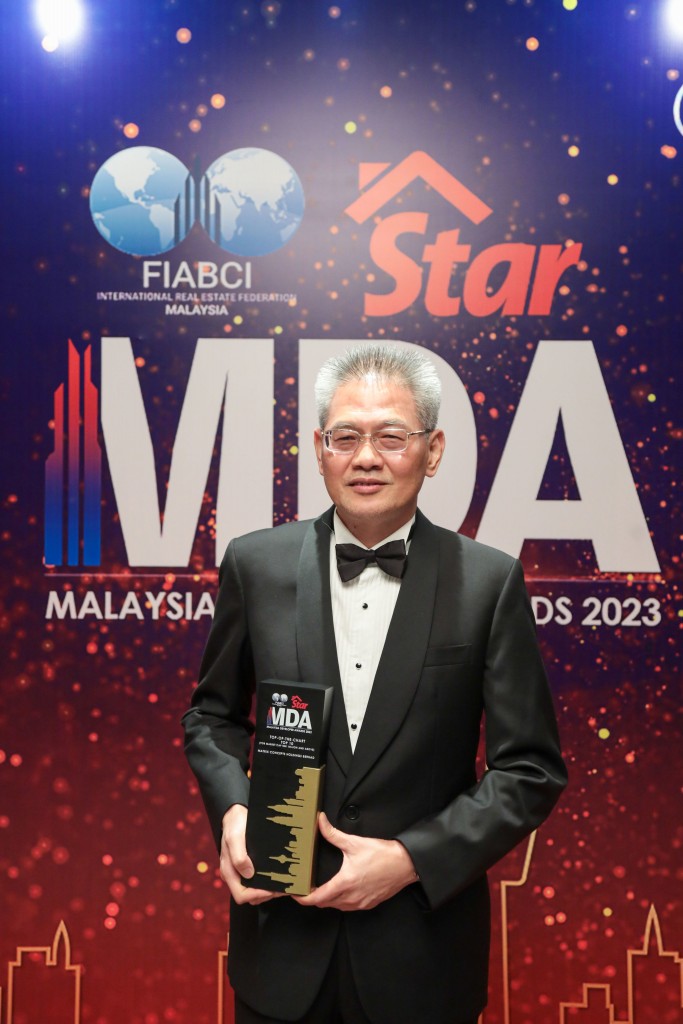 Matrix Concepts group managing director Ho Kong Soon holding his trophy.