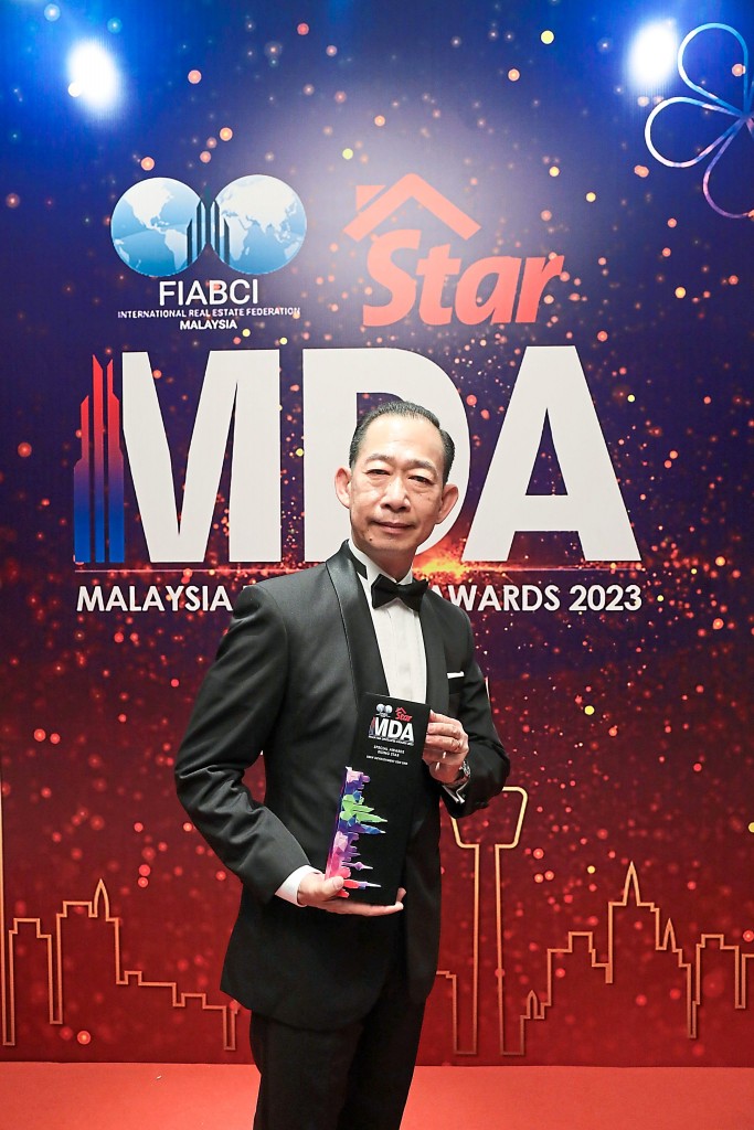 UMW Development property and development group director Eric Chew takes one home for his company.