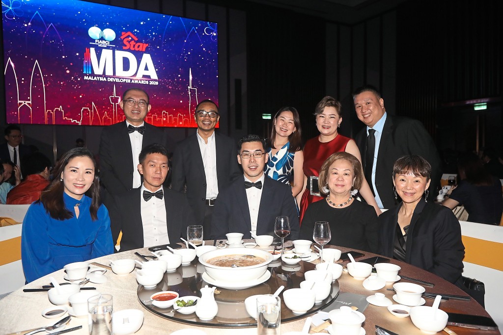 Team Mah Sing poses for a group photo.