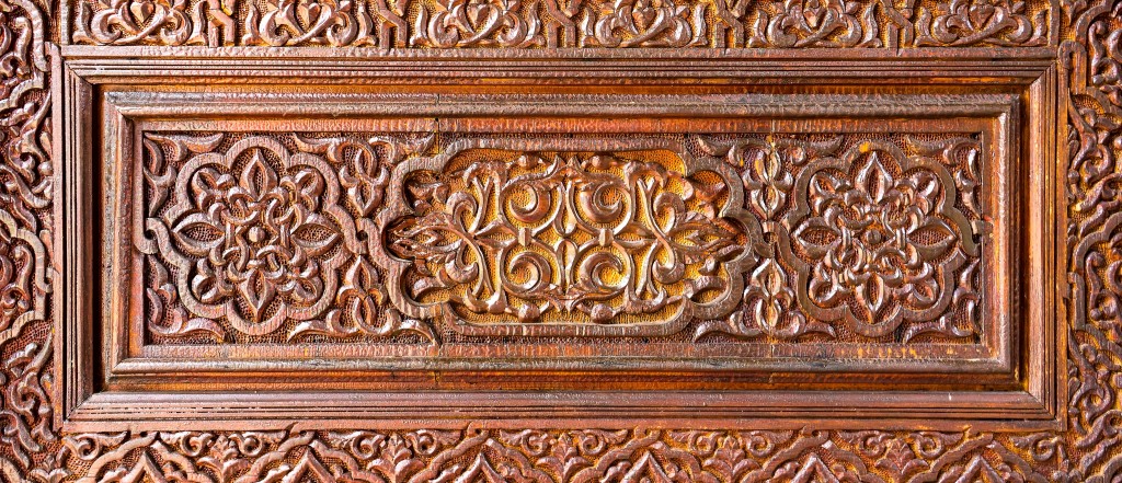 Intricate carvings depict a cultural tradition still kept alive today.