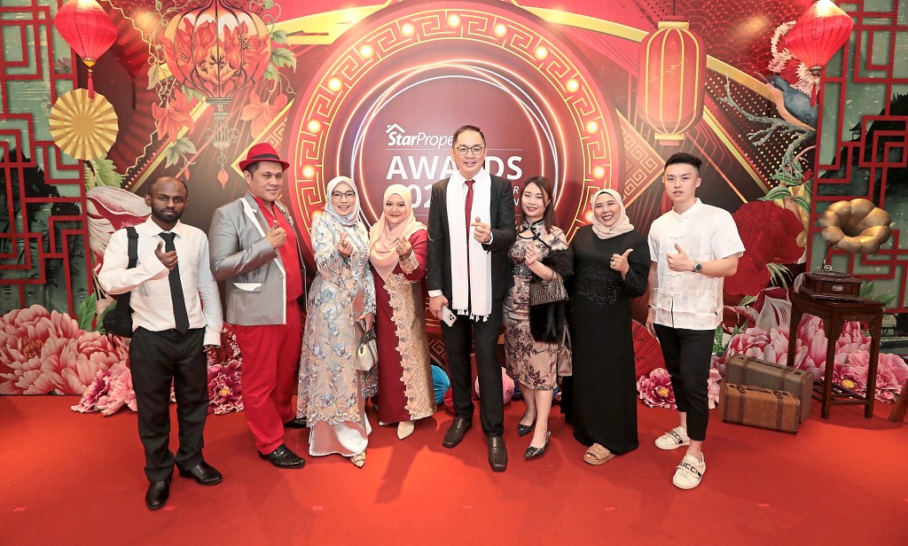 Ready to party: From left are Net, Aran, Wan, Azuin, Alan Ng, Quendy, Iza and Tim from Chester Properties.