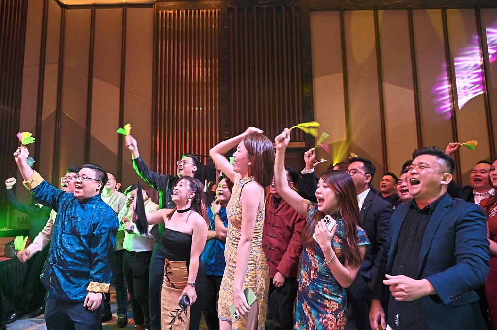 The sporting Knight World Realty team enlivened the event with their rattles as they cheer their winning colleagues.