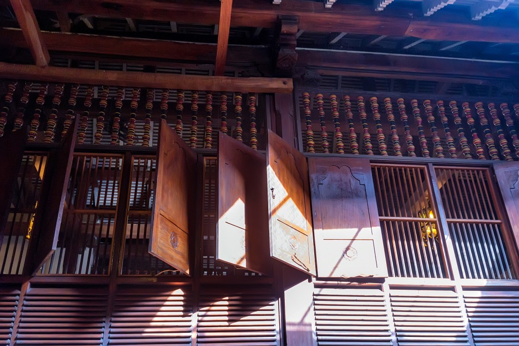 Sunlight filters in easily via the gaps in the wooden panels.