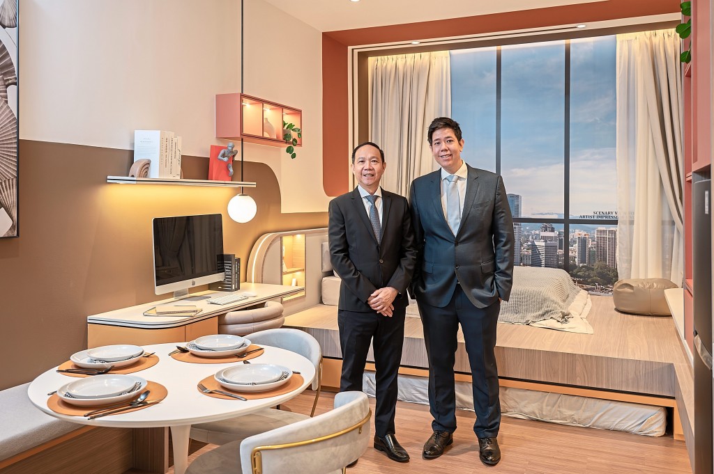 Hoo (left) and Ta standing in the  show unit to give a perspective of its  spaciousness.