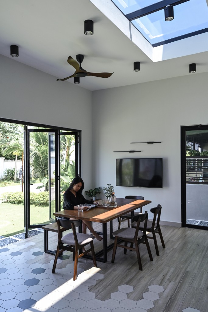 The "skylight" feature is complemented by large windows to allow the space to bask in natural light.
