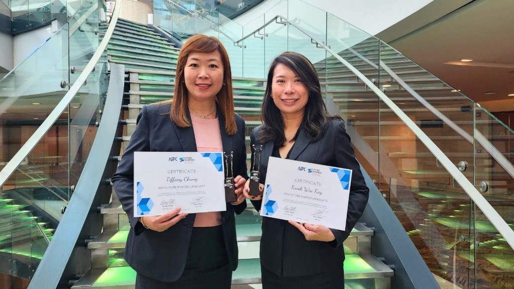 (From left) Chung and Kwok graduate AIPC Future Shapers with flying colours.