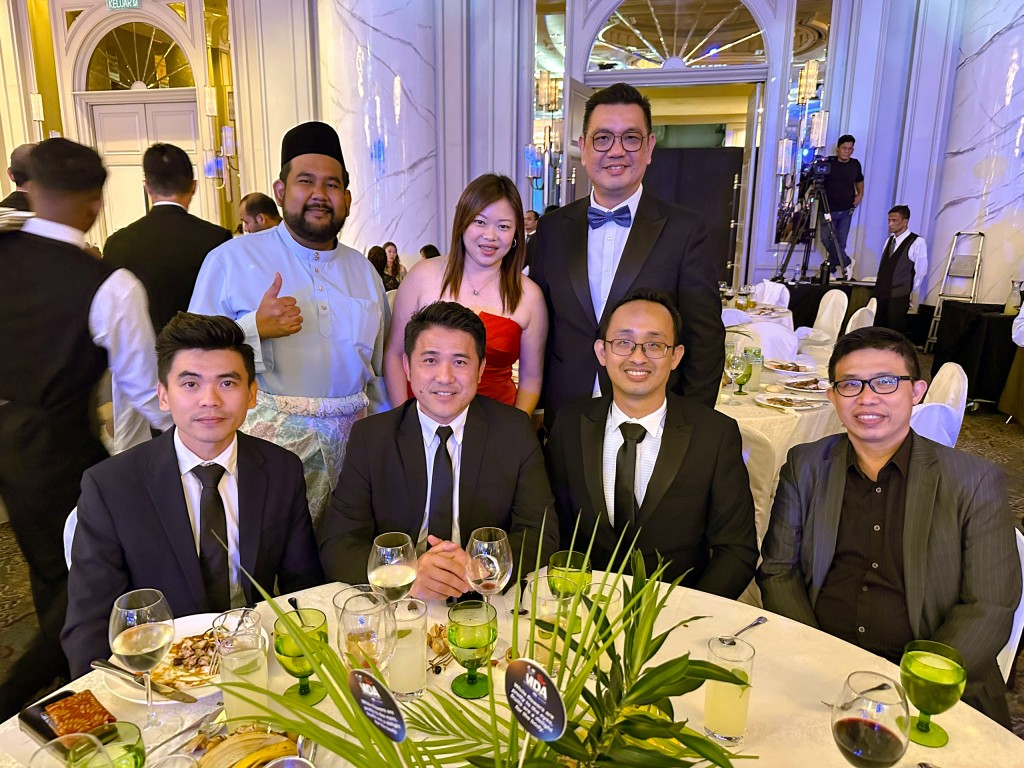 UAC Bhd building solutions head Hafiz Mohamad (standing from left) and national sales manager Henry Choo (standing from right) with his team.