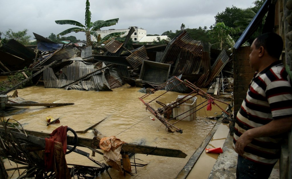 A resident looks helplessly at his destroyed batik factory at Kampung Lembah Sireh in Kota Baru, Kelantan during the 2014 flood. (Filepic/The Star)