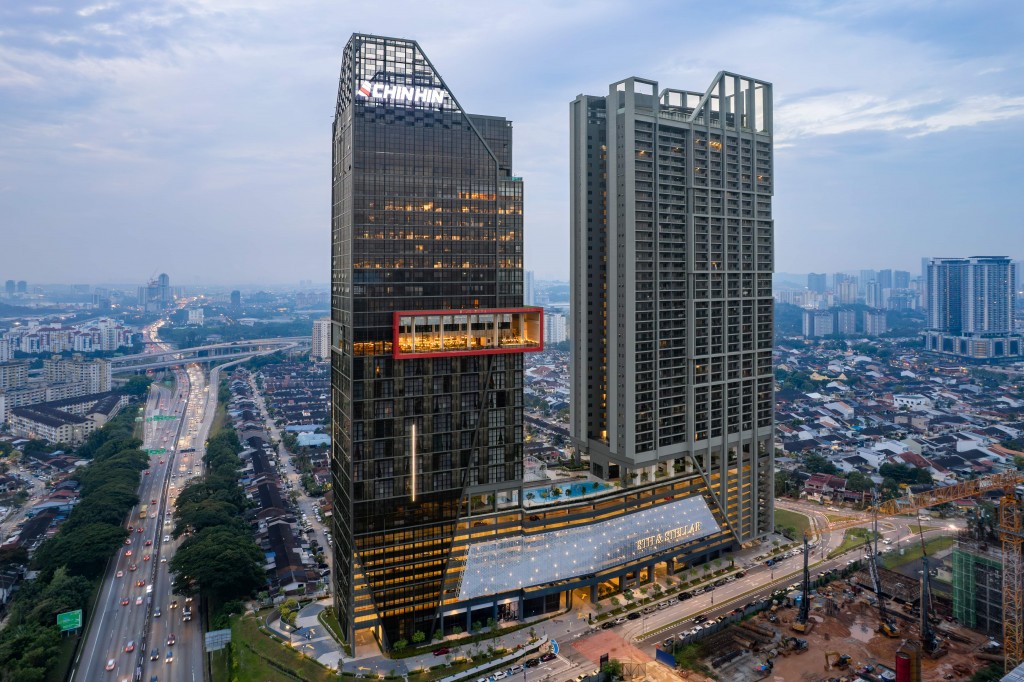 A striking view of twin towers rising over Sri Petaling — an iconic landmark along the KL–Seremban Highway.